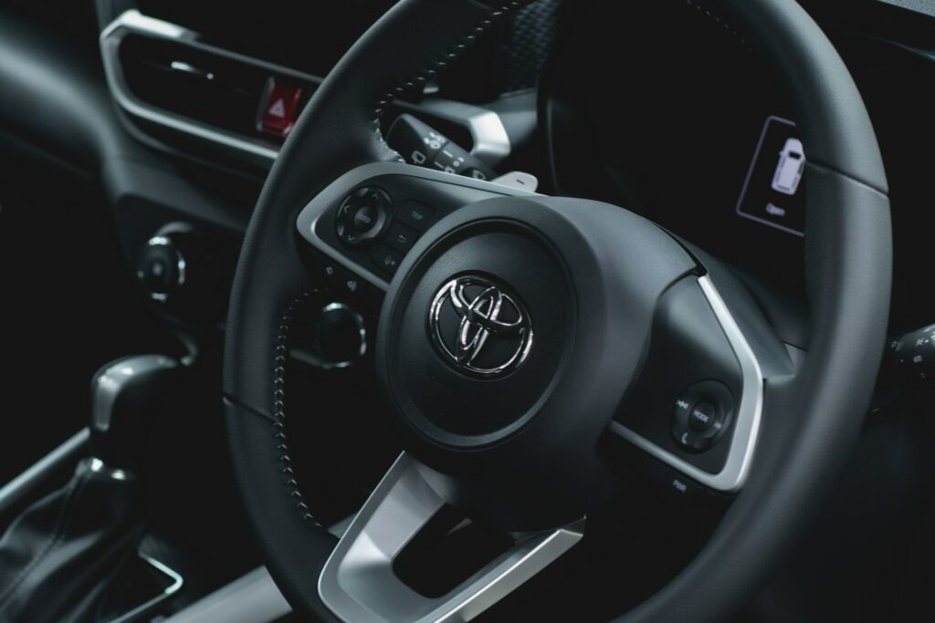 Inside view of a modern Toyota steering wheel which are often rent to own cars